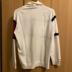A turtle neck white long sleeve.